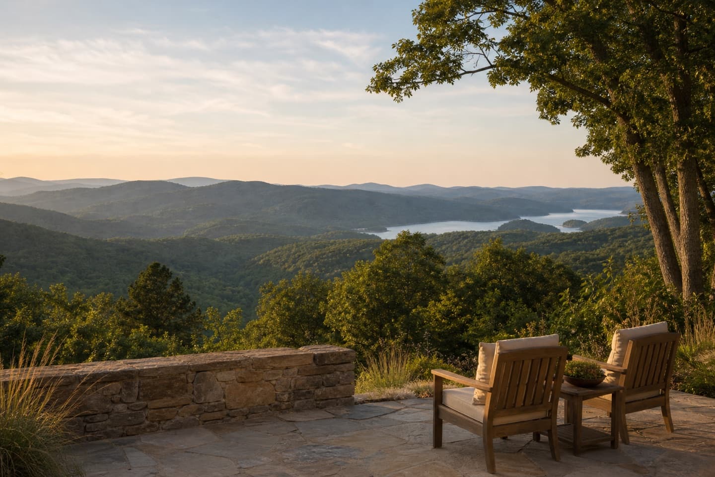 A quiet stone overlook facing the Blue Ridge foothills and a distant lake